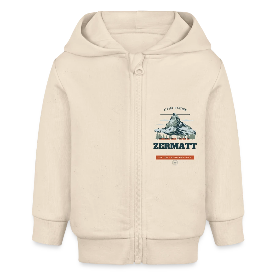 Zermatt badge on a baby organic zip-up hoodie by stanley/stella, soft Ecru