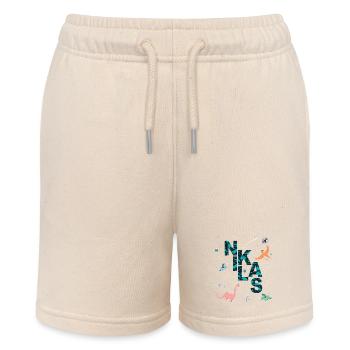 NIKLAS - Beautiful boy name with dinosaur - Stanley/Stella MINI BOLTER Organic Teen Jogging Shorts - soft Ecru - Front