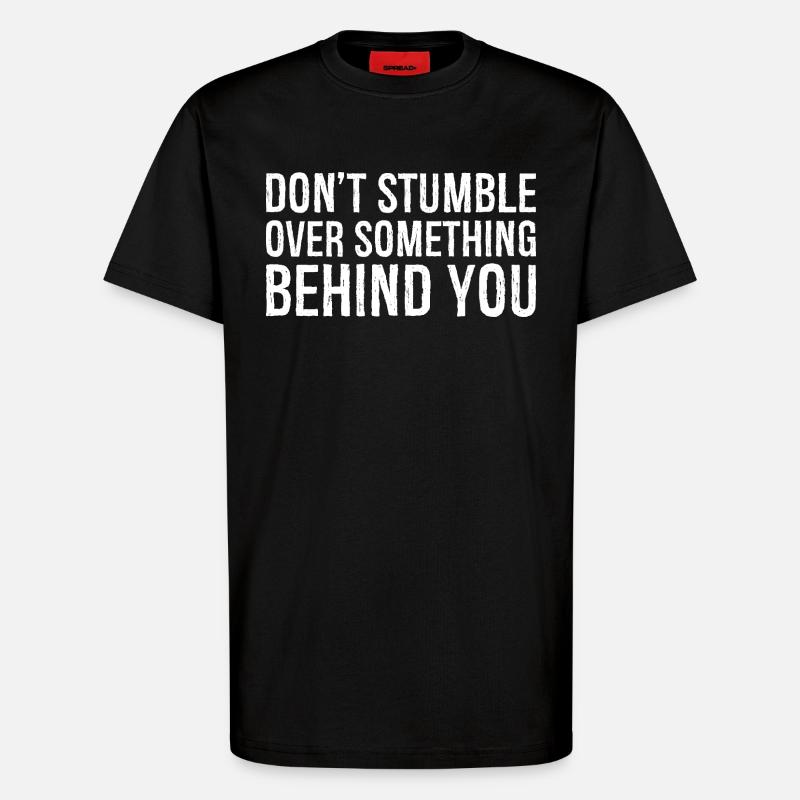 don't stumble over something behind you - T-Shirt - made by SPREAD - SOLID BLACK