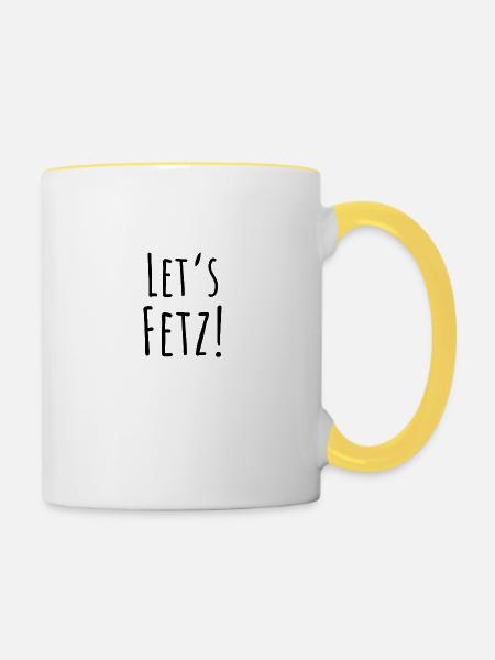 Statement "Let's fetz" in schwarz - Tasse zweifarbig - Weiß/Gelb