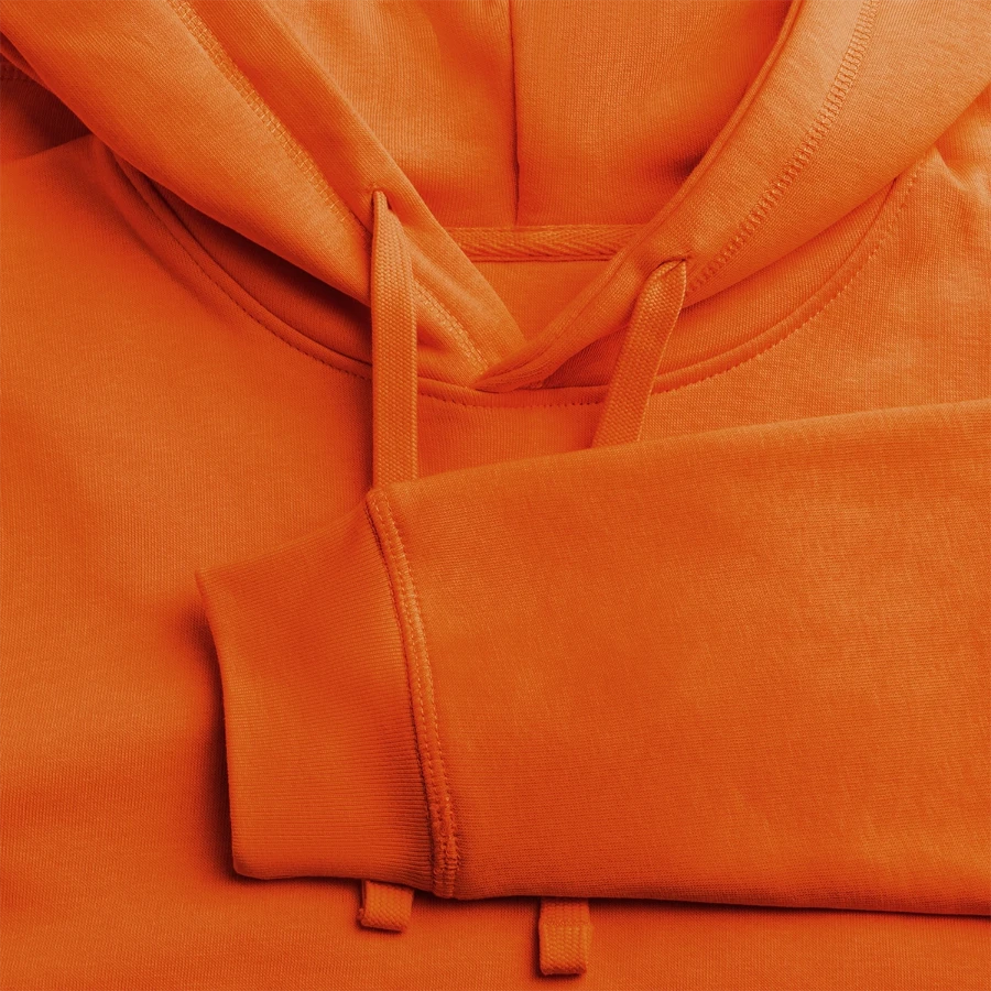 Bern badge on a stanley/stella drummer unisex organic hoodie, bright orange, close-up