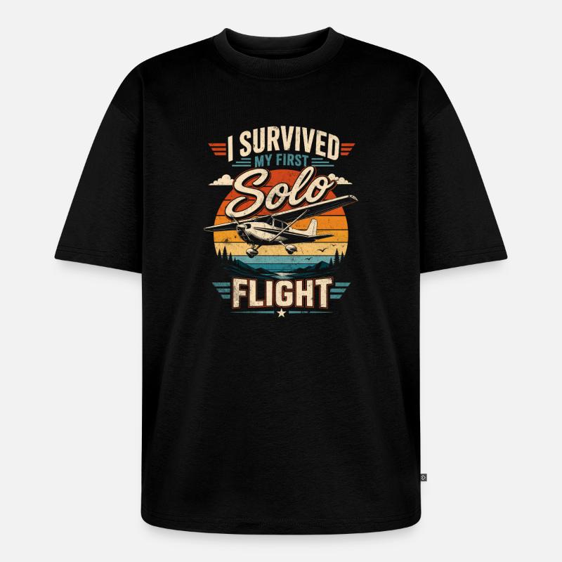 Ich überlebte meinen ersten Soloflug - Unisex Premium Oversized Bio T-Shirt - Schwarz