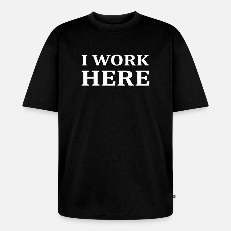 I work here - Unisex Premium Oversized Organic T-Shirt - black