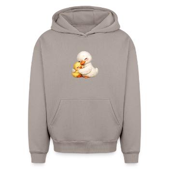 Mom duck cuddles with her baby - Oversized Heavyweight Unisex Hoodie - taupe - Front - AI Model Female 172 light (172cm) & AI Model Male 185 light (185cm)