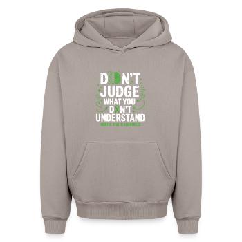 Don't judge what you don't understand - Oversized Heavyweight Unisex Hoodie - taupe - Front - AI Model Female 172 light (172cm) & AI Model Male 185 light (185cm)