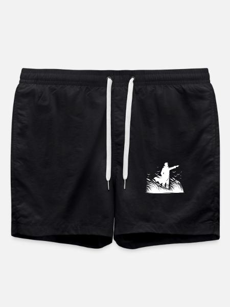 Stolzer Mann bei der Küstenwache am Meer - Badeshorts - Schwarz
