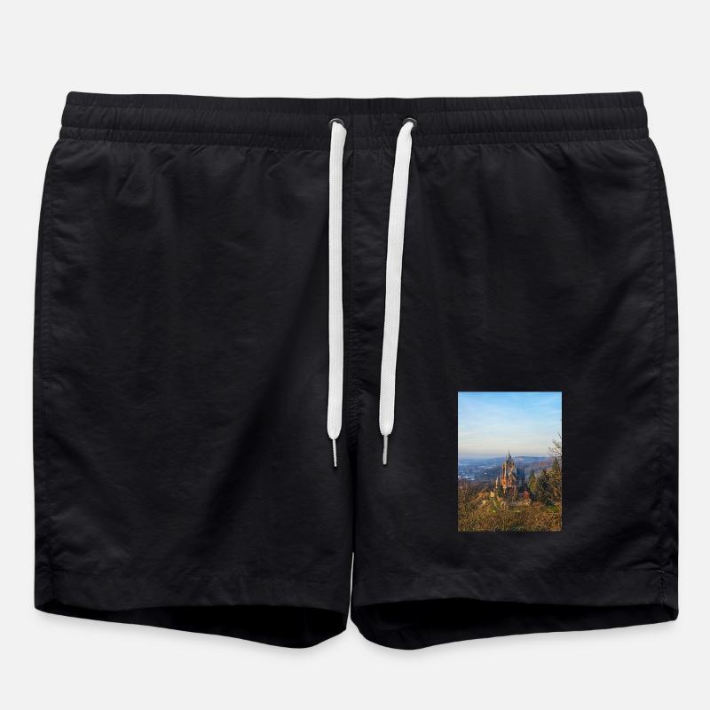 Drachenburg Castle on the slope in the evening light - Swim Trunks - black
