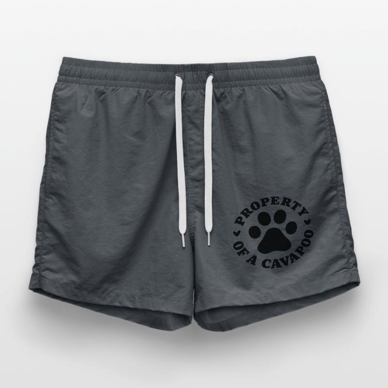 Eigentum eines Cavapoo Badeshorts