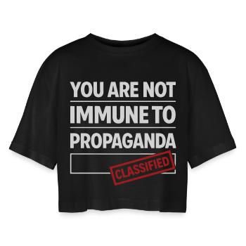 not immune to propaganda - Women’s Oversized Cropped T-Shirt - black - Front - AI Model Female 172 light (172cm)