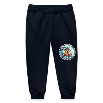 Surfendes Lebkuchenwellen-Abzeichen - Baby Organic Jogginghose Baby Tumbler von Stanley/Stella - Navy - Vorne