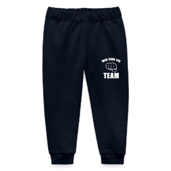 wir sind ein team - Baby Organic Jogginghose Baby Tumbler von Stanley/Stella - Navy - Vorne