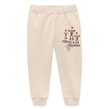 merry Christmas - Baby Organic Jogginghose Baby Tumbler von Stanley/Stella - Natur - Vorne