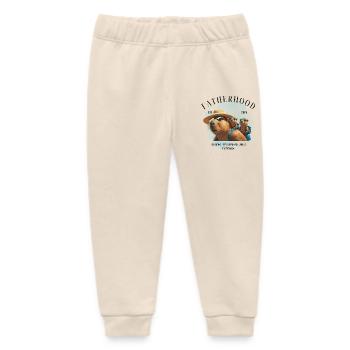 Fatherhood 2025 Raising Tiny Humans Like Capybara - Baby Organic Jogginghose Baby Tumbler von Stanley/Stella - Natur - Vorne