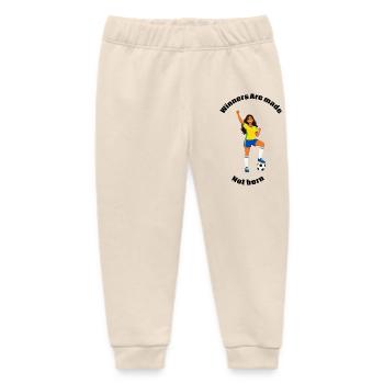 Fröhlicher Fußballer im gelben Trikot - Baby Organic Jogginghose Baby Tumbler von Stanley/Stella - Natur - Vorne