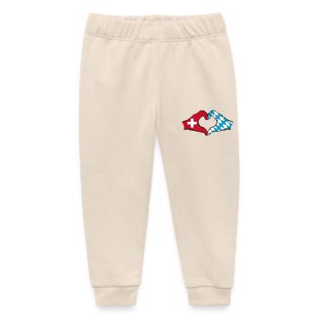 Schweiz Bayern Flagge Hände Herzform - Baby Organic Jogginghose Baby Tumbler von Stanley/Stella - Natur - Vorne