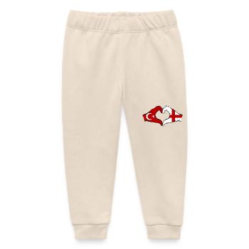 Türkei England Flagge Hände Herzform - Baby Organic Jogginghose Baby Tumbler von Stanley/Stella - Natur - Vorne