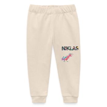 NIKLAS - Schöner Jungen Name mit Dinosaurier - Baby Organic Jogginghose Baby Tumbler von Stanley/Stella - Natur - Vorne