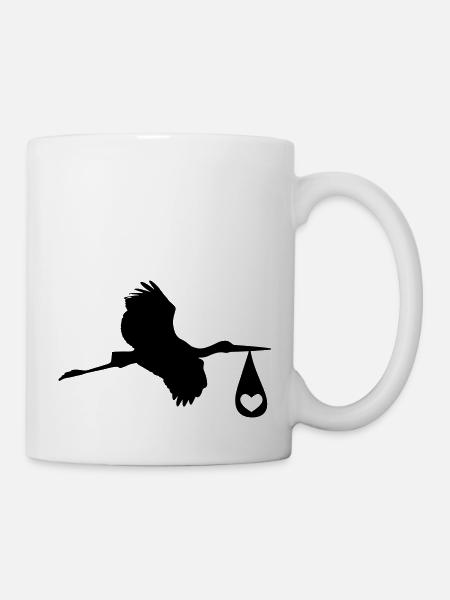 La cigogne cliquetante amène les nouveau-nés - Mug blanc - blanc
