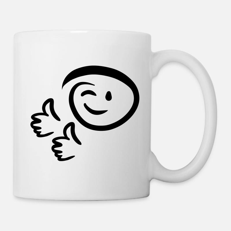 Le visage fait un clin d’œil, montre deux pouces en l’air. Émoticône. - Mug blanc - blanc