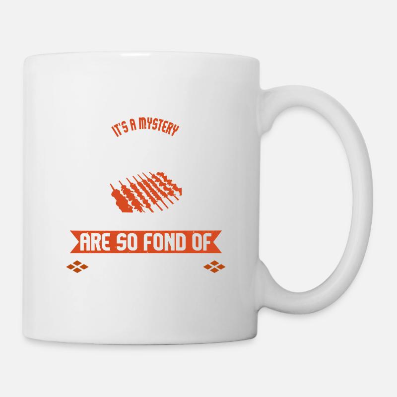 ES IST EIN RÄTSEL, WARUM MÄNNER SO GERNE GRILLEN - Tasse - Weiß