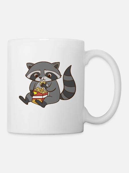 A cute raccoon eats popcorn. - Mug - white