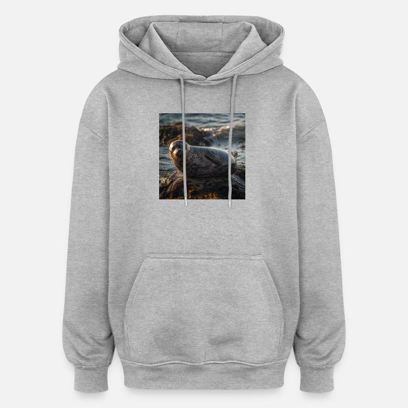 Robbe auf der Klippe am Meer - Oversized Unisex Hoodie - Grau meliert