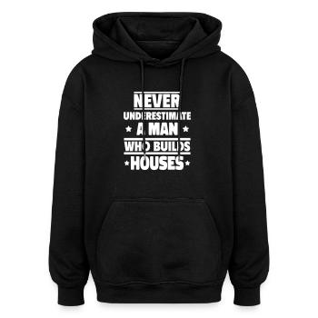 Never underestimate a man who builds houses - Oversized Unisex Hoodie - black - Front - Noah (186cm)