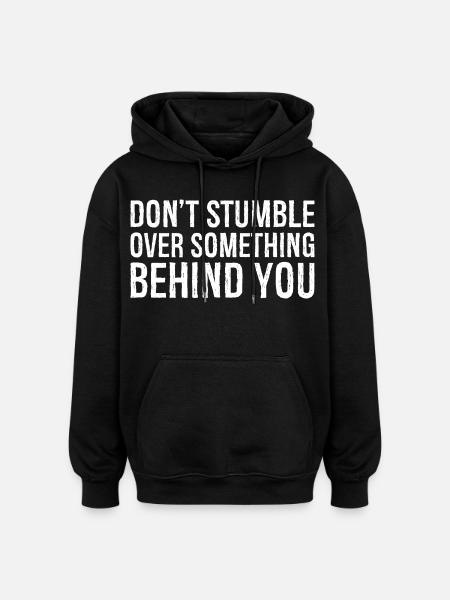 don't stumble over something behind you - Oversized Unisex Hoodie - black