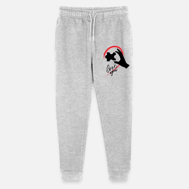 Mano che tiene un puzzle metà di un cuore - Pantaloni sportivi ecologici Mini Mover per ragazzi di Stanley/Stella - grigio melange