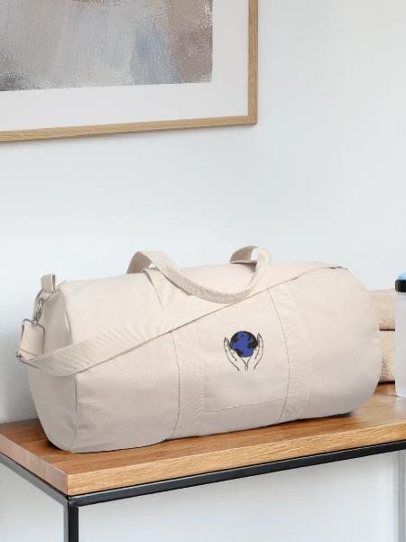 welt in händen - Recycelte Canvas-Sporttasche von Stanley/Stella - Naturweiß - Vorne