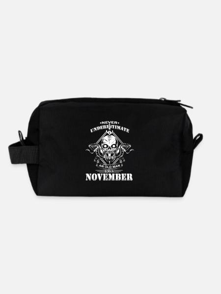 Never underestimate an old man in November - Recycled Toiletry Zip Bag - black - Back