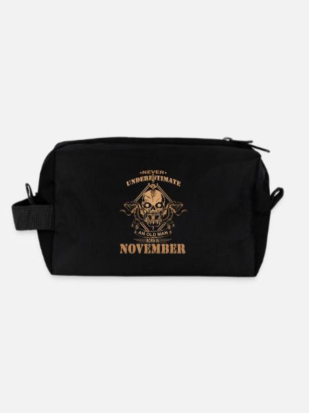 Never underestimate an old man in November - Recycled Toiletry Zip Bag - black - Back