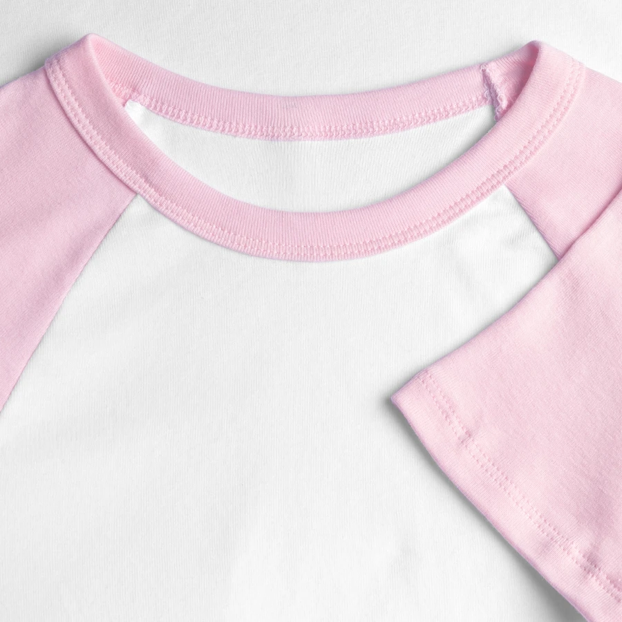 Lucerne badge on a women's cropped baseball t-shirt, white/pink, close-up