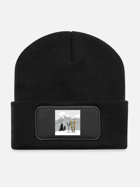 Skiing in winter in the mountains - Recycled Patch Beanie - black