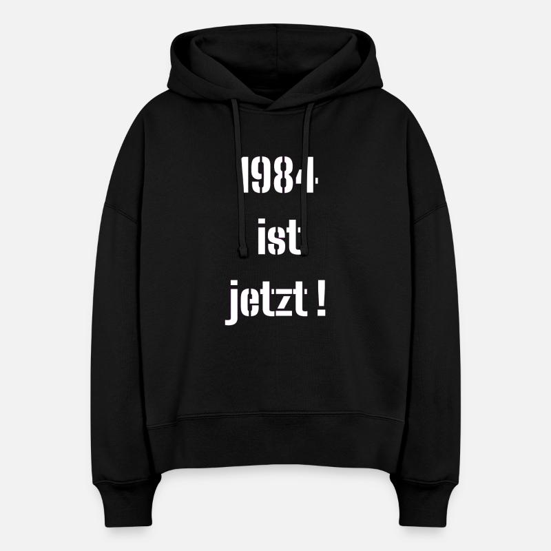 1984, C’EST MAINTENANT ! - Sweat à capuche bio Nora coupe boxy Stanley/Stella Femme - noir