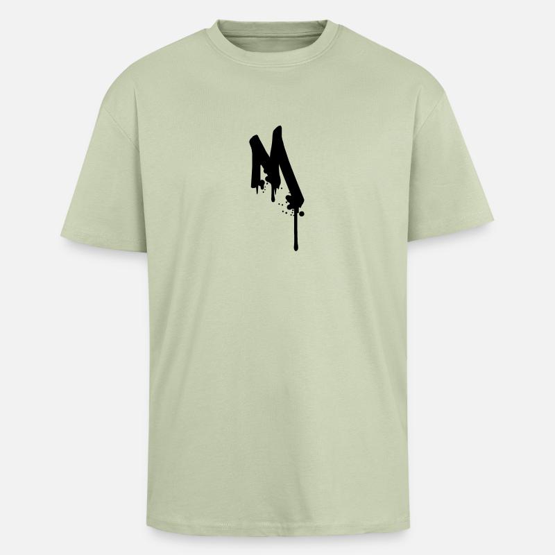 M graffiti drops Farbklex spray - Unisex Oversized Heavyweight T-shirt - soft salvia 