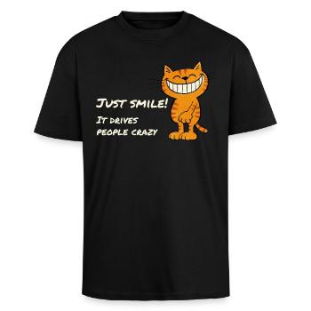 Just Smile – Cheeky grinning cat saying - Unisex Oversized Heavyweight T-shirt - black - Front - Alina (178cm) & Michal (187cm)