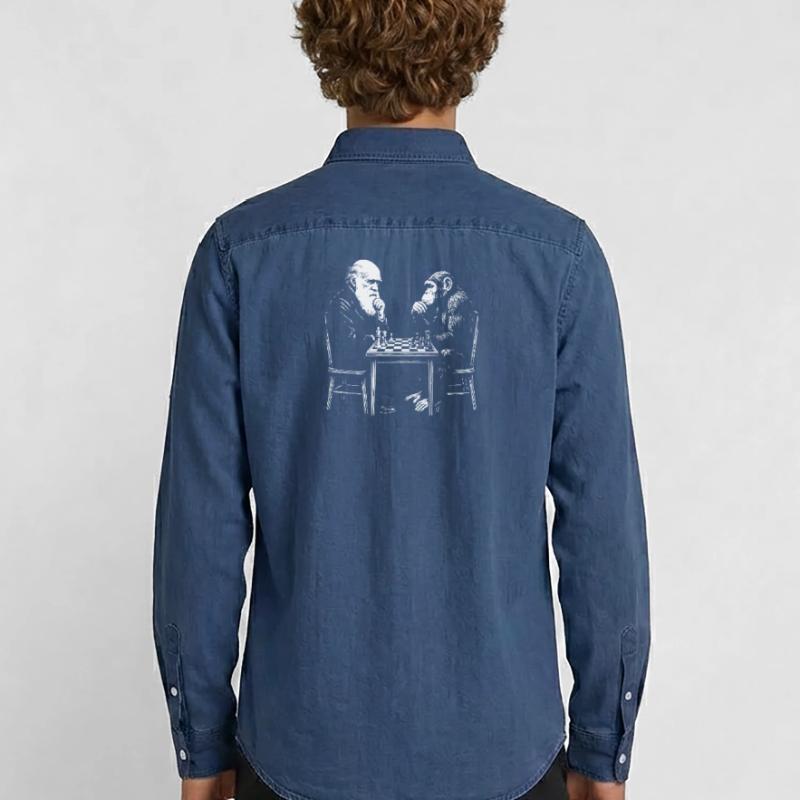 Darwin plays chess with monkey - Evolution game Men’s Organic Denim Shirt by Stanley/Stella
