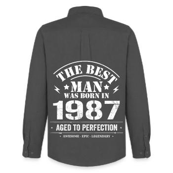 Né(e) en 1987 Date de naissance 1987 - 38 ans Rétro - Chemise Oxford homme Stanley/Stella - charbon - Dos - AI Model Male 185 dark (185cm)