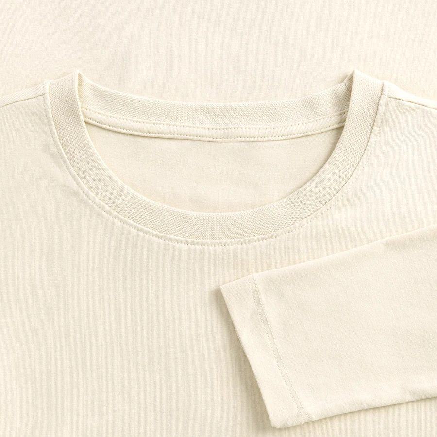 Switzerland badge on a women's slim fit longsleeve, creme, close-up