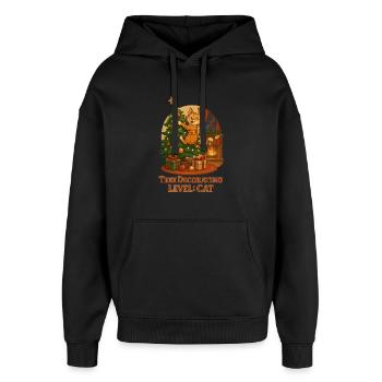 Le chat décore le sapin de Noël - Sweat à capuche unisexe Stanley/Stella Oversized - noir - Devant - AI Model Female 172 light (172cm) & AI Model Male 185 light (185cm)