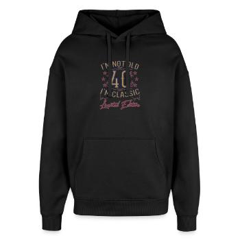 Dicton drôle du 40e anniversaire vintage - Sweat à capuche unisexe Stanley/Stella Oversized - noir - Devant - AI Model Female 172 light (172cm) & AI Model Male 185 light (185cm)
