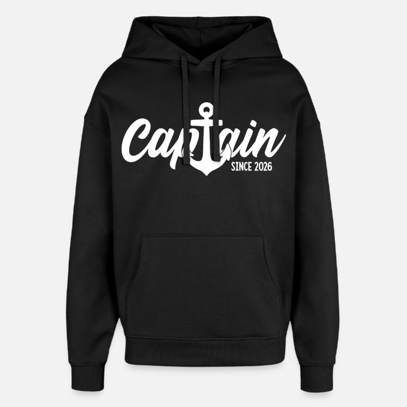 CAPITAINE 2026 CAPITAINE DEPUIS 2026 - Sweat à capuche unisexe Stanley/Stella Oversized - noir