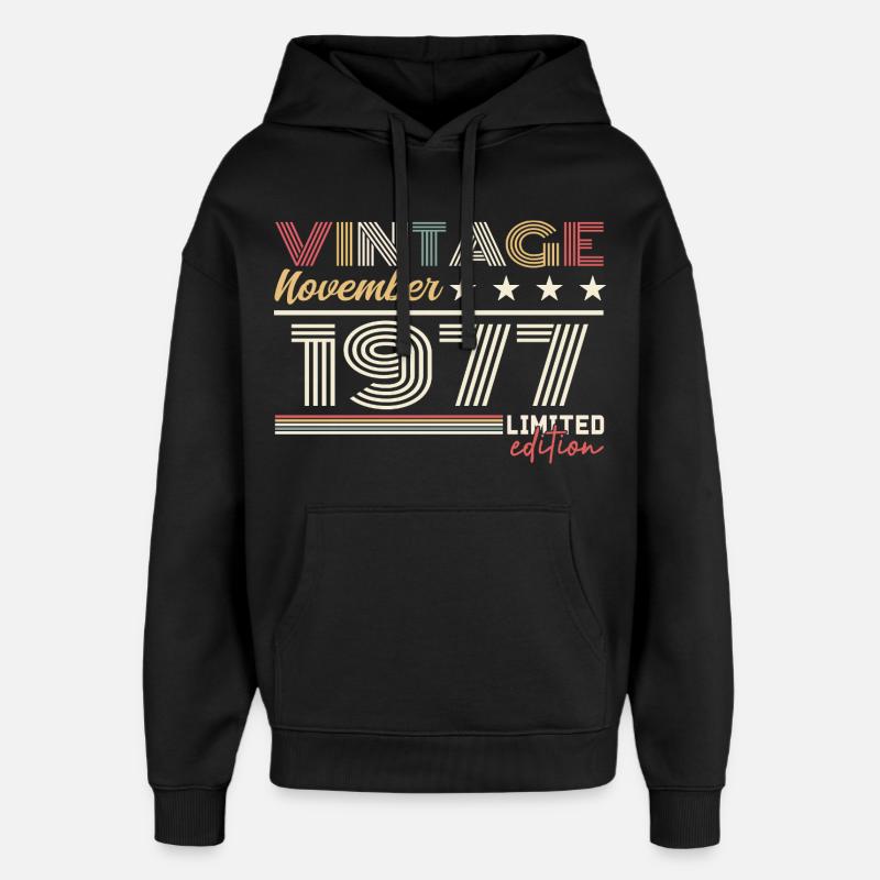 Novembre 1977 - Sweat à capuche unisexe Stanley/Stella Oversized - noir