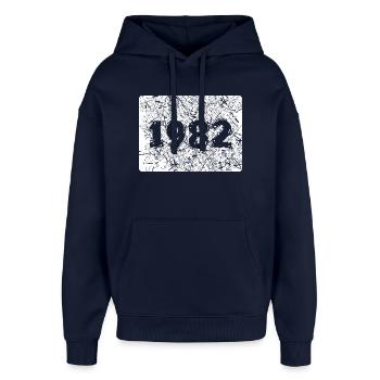 Année rétro 1982 avec design de démolition - Sweat à capuche unisexe Stanley/Stella Oversized - marine - Devant - AI Model Female 172 light (172cm) & AI Model Male 185 light (185cm)