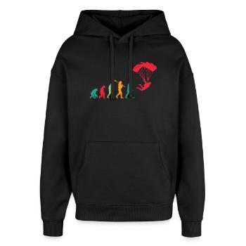 Fallschirm Evolution Fallschirmspringer - Oversized Unisex Hoodie von Stanley/Stella - Schwarz - Vorne - AI Model Female 172 light (172cm) & AI Model Male 185 light (185cm)