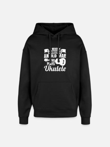 Never underestimate old ukulele players - Oversized Unisex Hoodie by Stanley/Stella - black