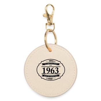 All original parts of 1963 - Round Keyring - oyster - Front