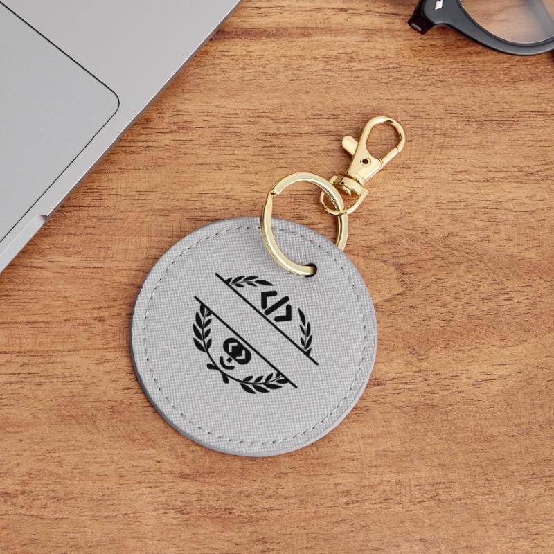 Code logo et code smiley dans une couronne de laurier Porte-clés rond