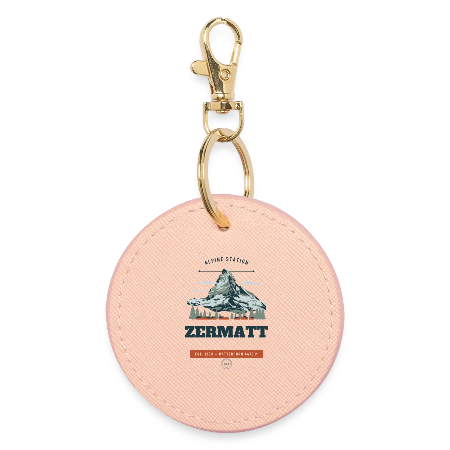 Zermatt badge on a round keyring, light pink